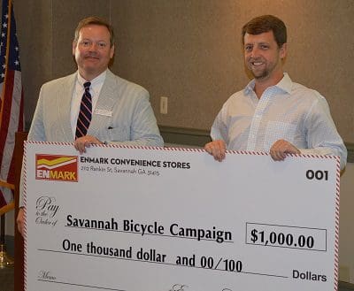 matt_clements_right_director_of_marketing_for_enmark_stations_presents_john_bennett_left_director_of_the_savannah_bicycle_campaign_a_check_for_1000_resized.jpg