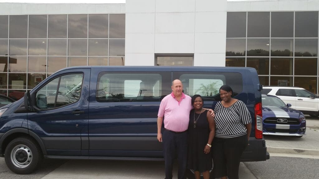  (LEFT TO RIGHT) O.C. Welch III, President of O.C. Ford and Lincoln; DaShauna Kimble, PPO Sr. Case Manager; and Stephanie Williams, PPO Night House Manager, stand in front of the new Ford Transit.