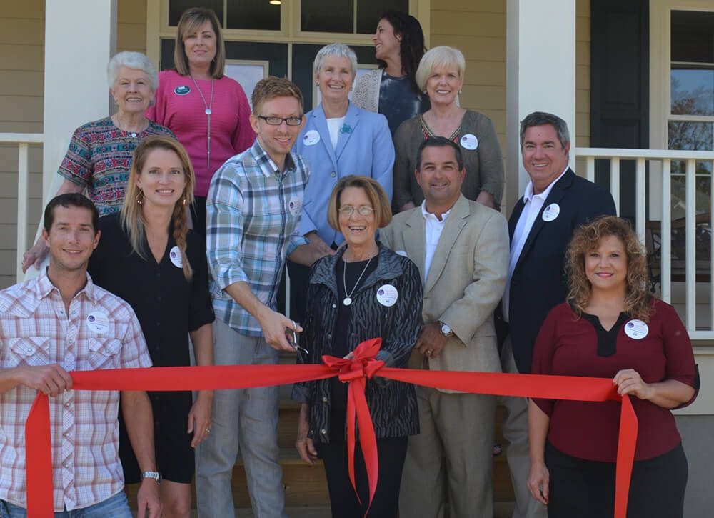 beside-their-mother-gretchen-greene-front-center-trina-and-travis-dodd-front-left-cut-the-ribbon-on-the-new-gretchen-greene-school-of-dance-studio