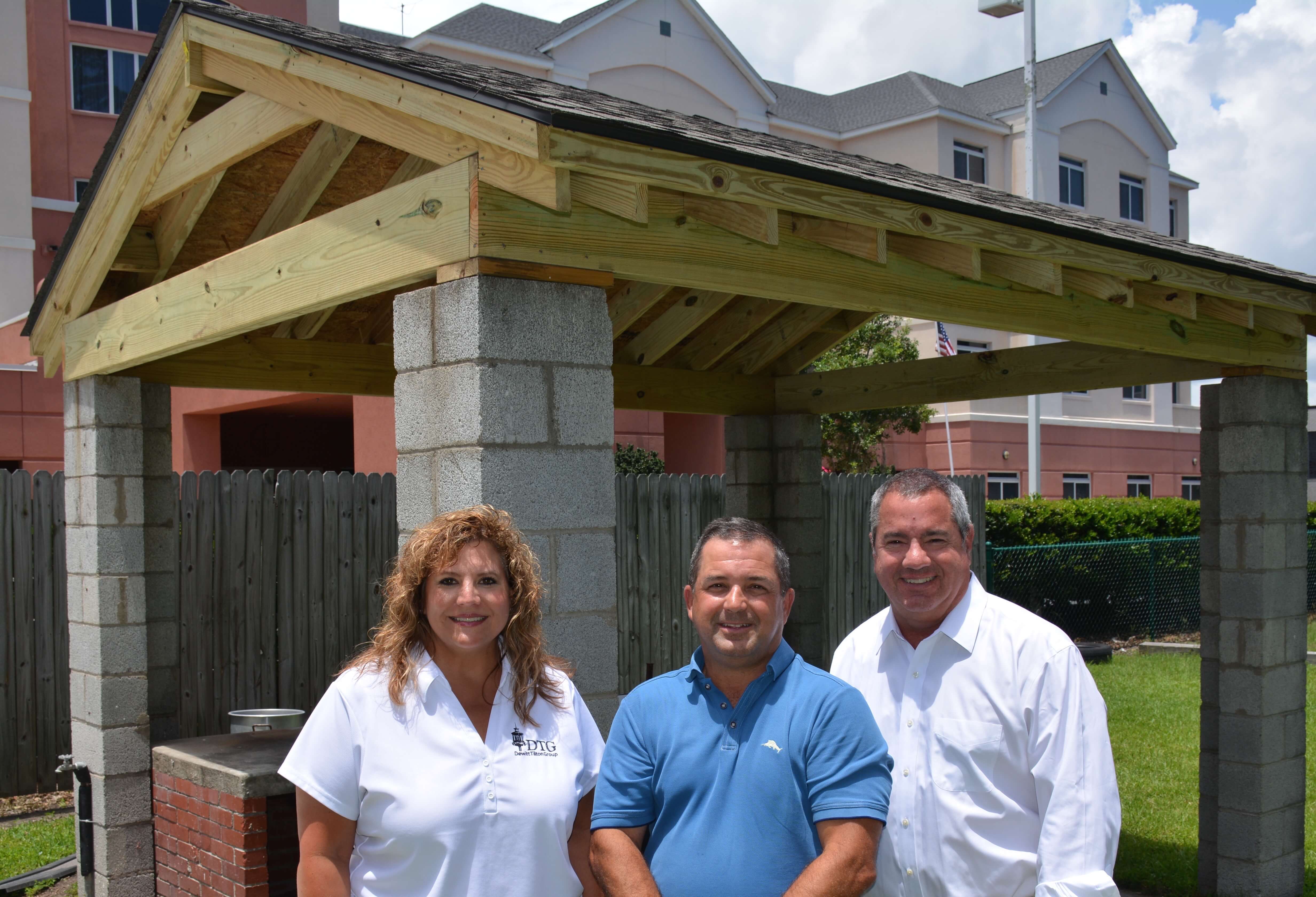 Pictured (Left to Right): Kim Thomas, Chris Tilton and Andrew DeWitt of the Dewitt Tilton Group in front of the newly built BBQ Pitt Roof for the Savannah Jaycees.