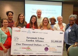 Enmarket and Healthy Savannah presents check to SUGA