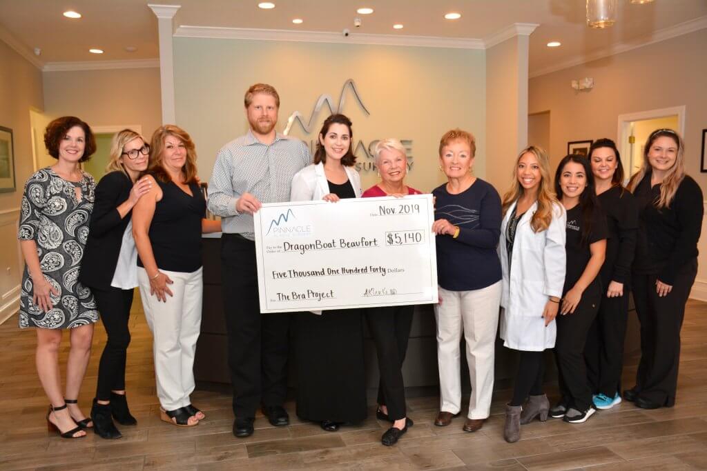 Pinnacle Medical Group presented $5,140 to representatives of DragonBoat Beaufort